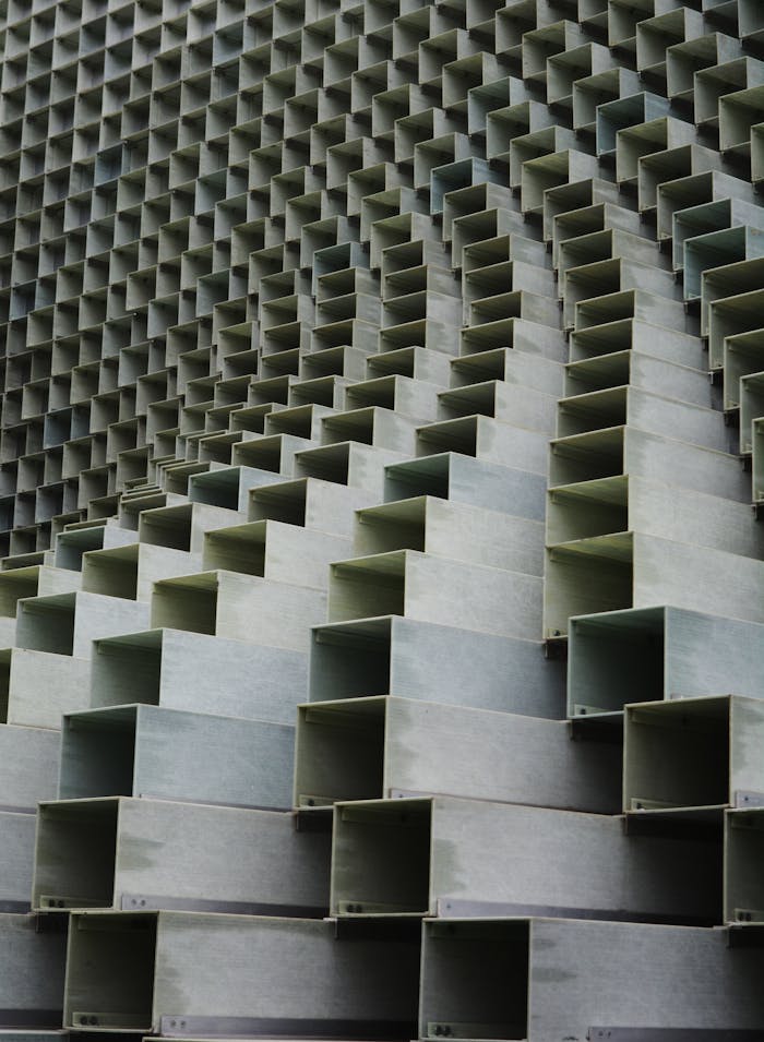 Intricate close-up of a modern architectural metal pattern indoors.